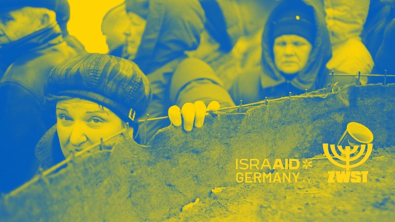 Menschen an einem Zaun
